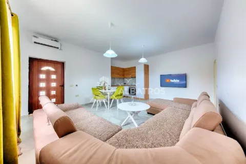 Spacious living room connected to the dining area and kitchen. - image 5