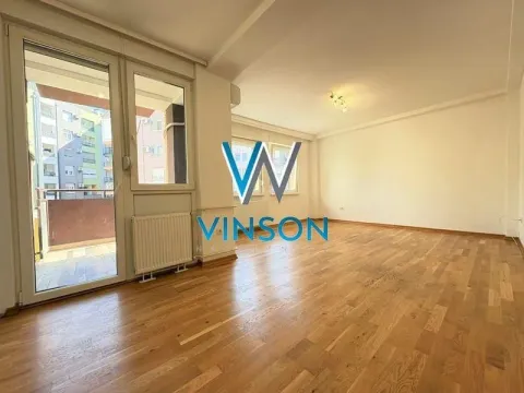 Empty living room with wooden flooring and access to the terrace. - image 2