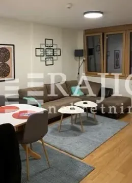 Living room with a sofa set and dining table. - image 2