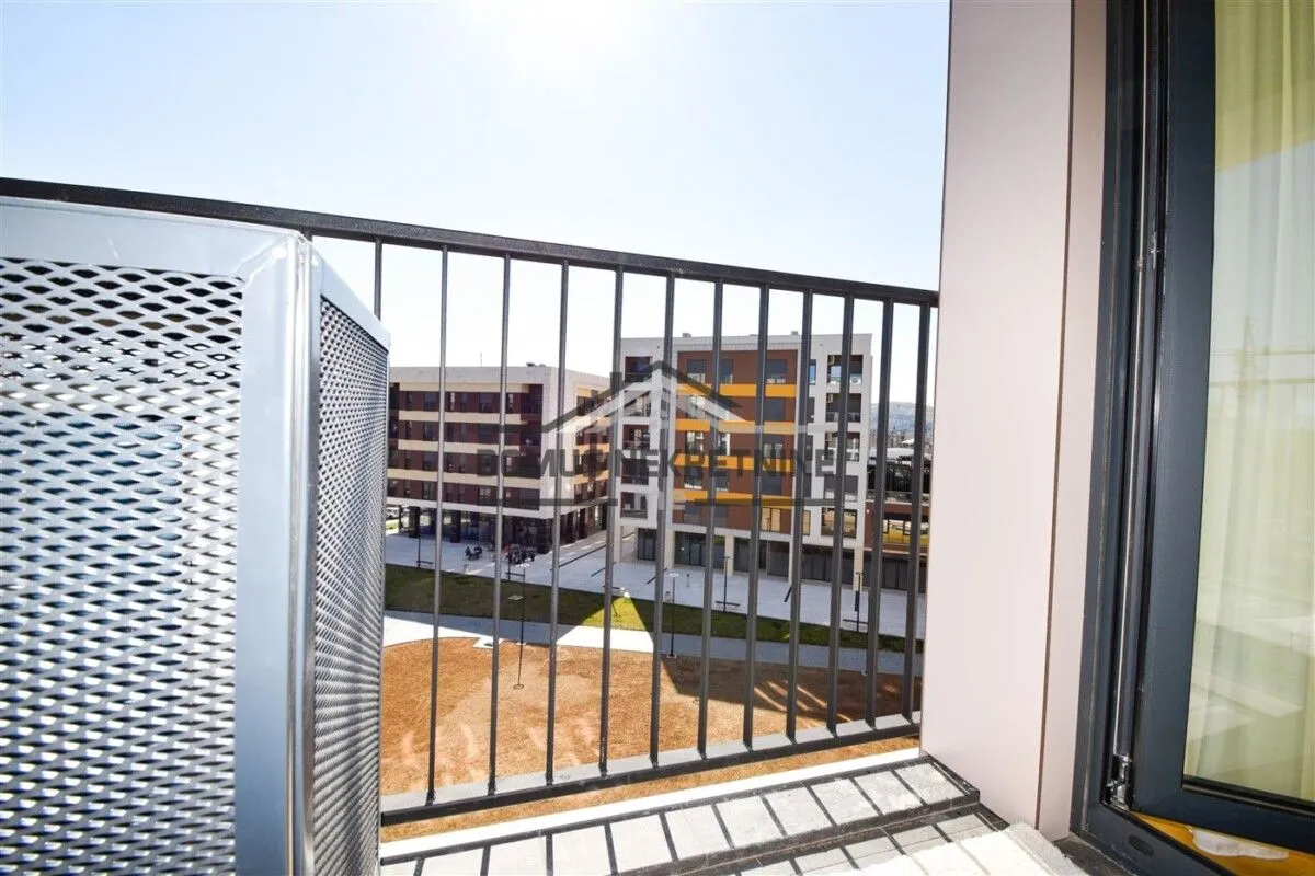 View from the balcony overlooking surrounding residential buildings.
