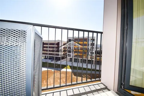 View from the balcony overlooking surrounding residential buildings. - image 11