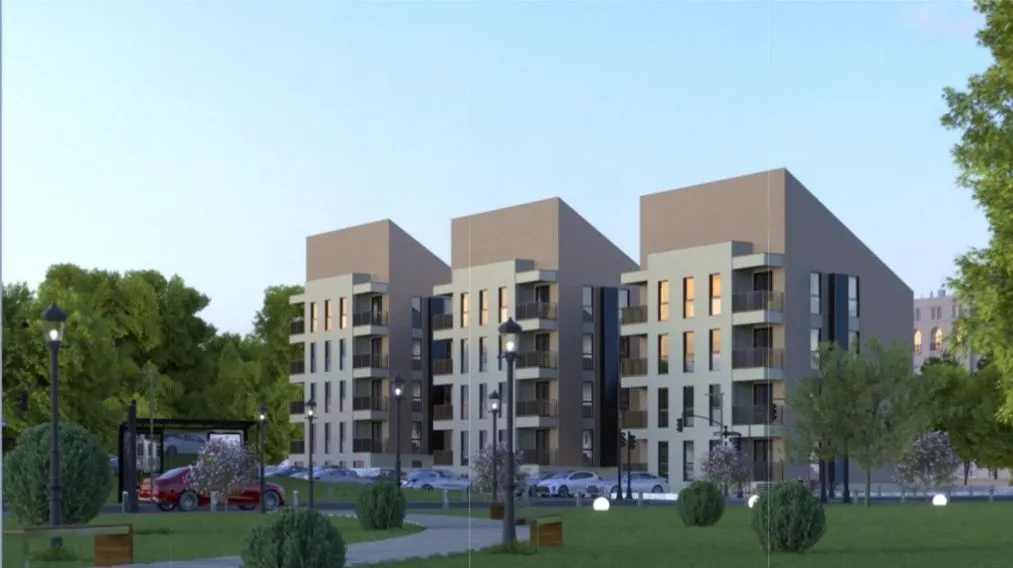 Spoljašnji izgled modernih stambenih zgrada sa uređenim dvorištem.