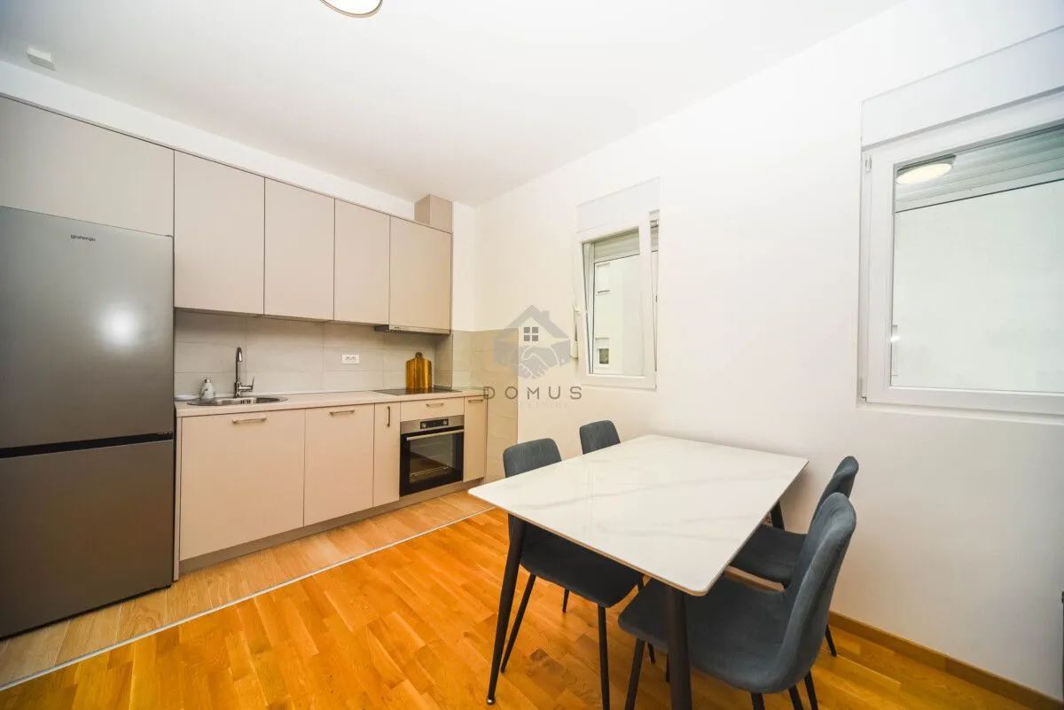Kitchen with dining area and modern furniture.