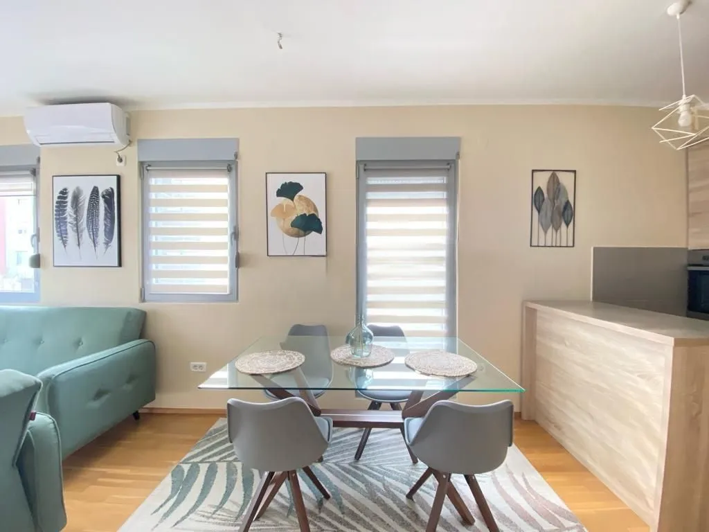 Living room with dining area and partial kitchen.