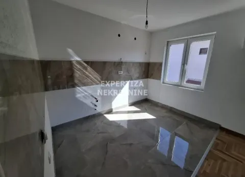 Empty kitchen with ceramic tiles and a window. - image 7