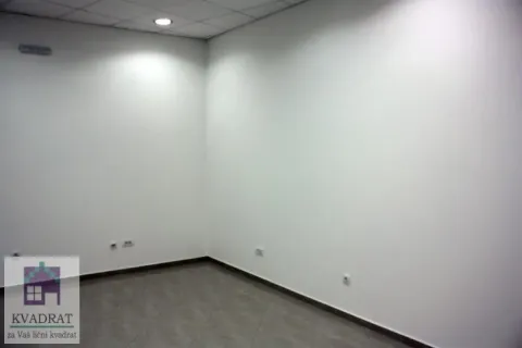 An empty room with white walls and tiled flooring. - image 4