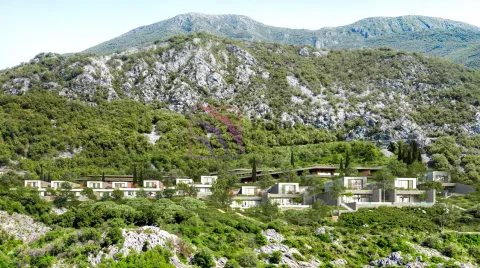 Pogled na kompleks vila u izgradnji okružen planinskim pejzažom. - image 10