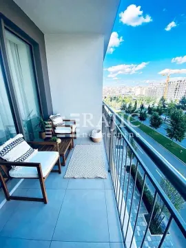 Furnished balcony with seating set and city view. - image 14