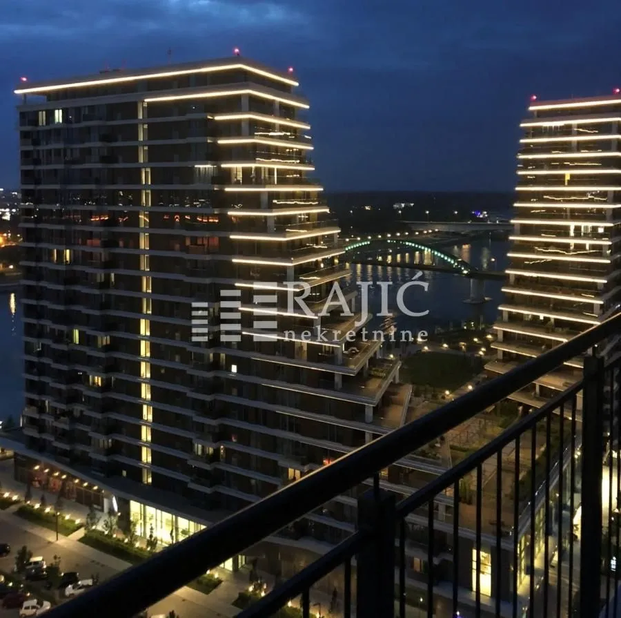 View from the terrace of modern buildings and the city at dusk.