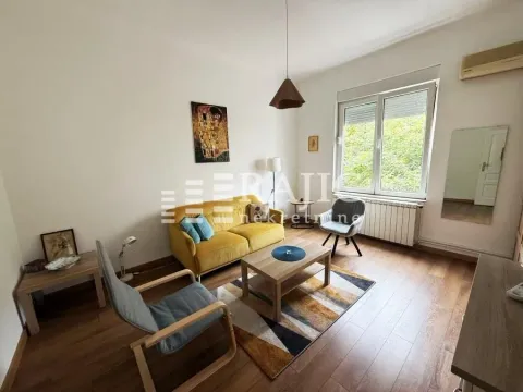 Living room with sofa, coffee table and window. - image 2