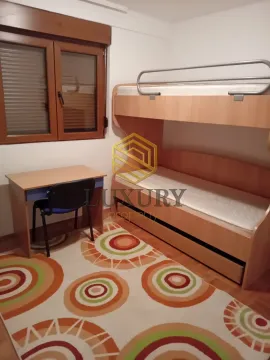 Children's bedroom with a bunk bed and a desk. - image 5
