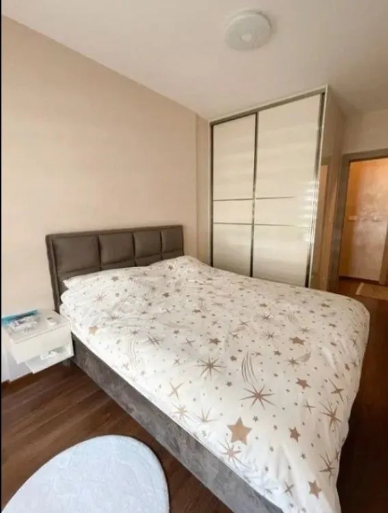 Bedroom with a double bed and a fitted wardrobe.