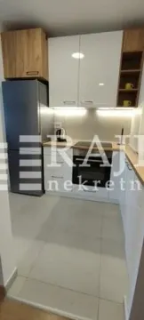 Modern kitchen with white and wooden elements. - image 4
