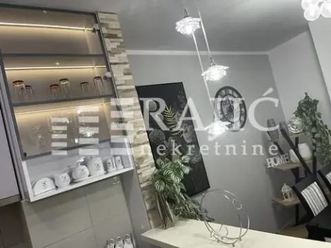 Modern kitchen with illuminated cabinets and a dining area. - image 8
