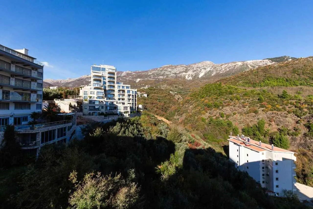 View of the mountains and surrounding buildings from the apartment.