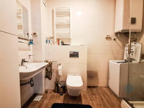 Bathroom equipped with sanitary fixtures, washbasin, toilet bowl and washing machine. - image 9