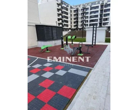 Outdoor area with workout equipment in front of the building. - image 14