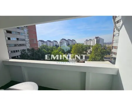 View from the balcony overlooking surrounding buildings and the neighborhood. - image 15
