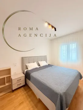 Bedroom with a double bed, nightstand, and window. - image 6