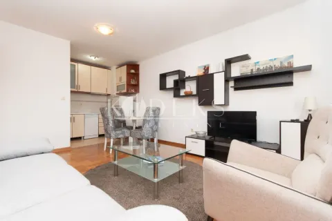 Living room with dining area and kitchen in the background. - image 4