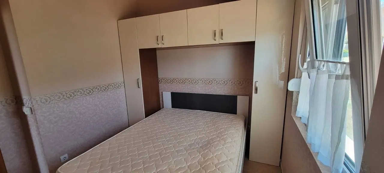 Furnished bedroom with a double bed and fitted wardrobes.