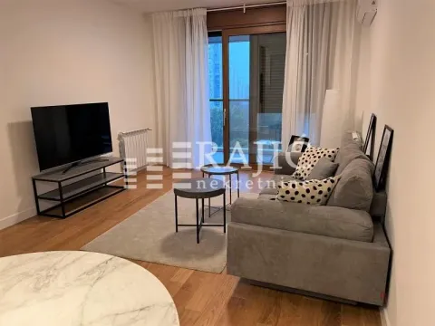 Living room with sofa, TV and access to the terrace. - image 2