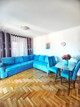 Living room with a sofa set and a dining table. - image 3