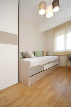 Bright children's or guest bedroom with a bed and wardrobe. - image 5