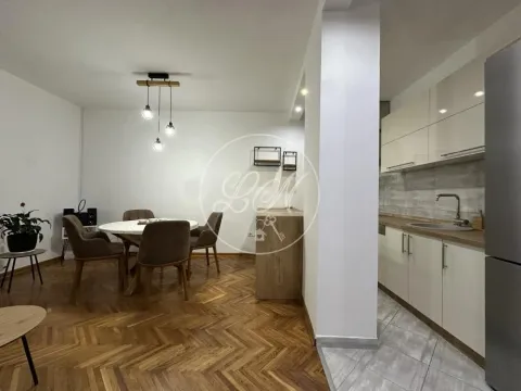 Open plan space with a kitchen and dining area. - image 5