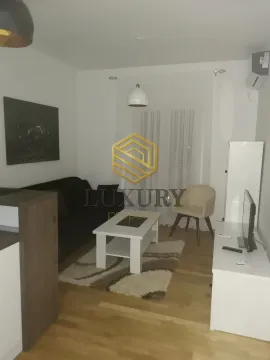 Living room with sofa, coffee table and TV unit. - image 6