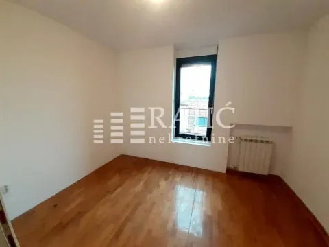 Empty room with parquet flooring and a window. - image 17