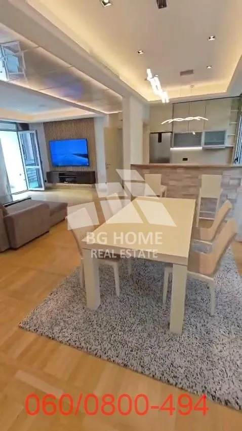 Spacious living room with dining area and kitchen.
