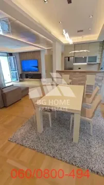 Spacious living room with dining area and kitchen. - image 4