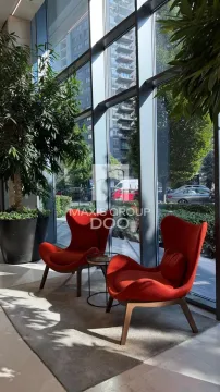 Living room with comfortable red armchairs and large glass windows. - image 17