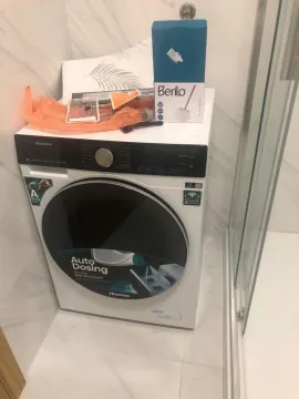 Washing machine in the bathroom next to the shower cabin. - image 11