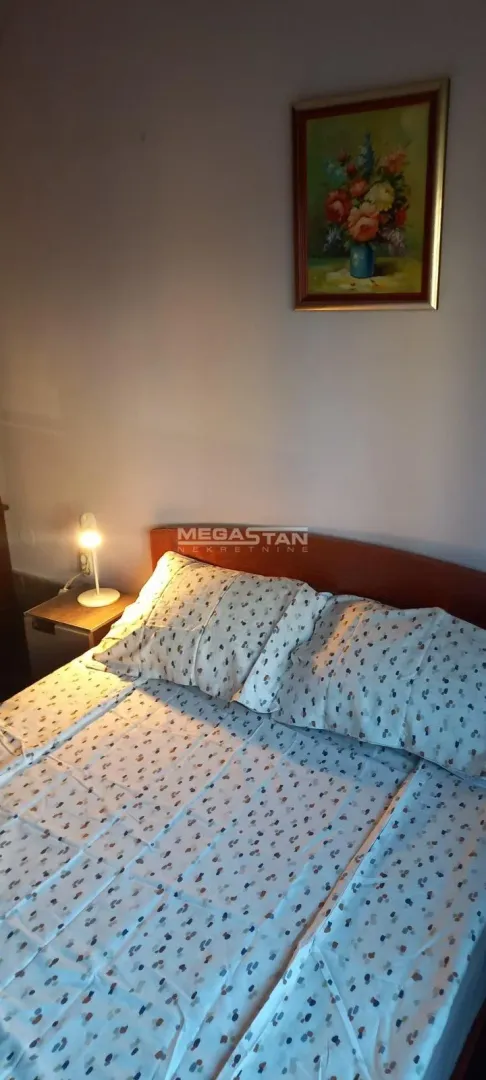 A view of the bed with pillows in the bedroom.