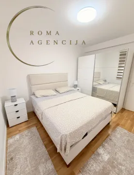 Bright and tidy bedroom with a double bed and wardrobe. - image 6