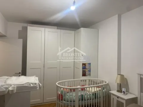 Children's room with a crib, wardrobe, and changing table. - image 5