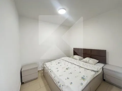 Bedroom with a double bed and bedside tables. - image 4