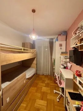 Children's bedroom with a bunk bed and a desk. - image 10