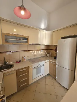Compact kitchen with fitted units and home appliances. - image 4