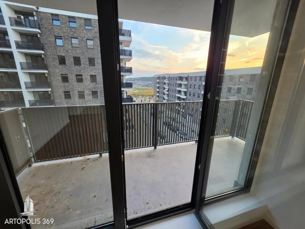 View from the balcony overlooking surrounding residential buildings.