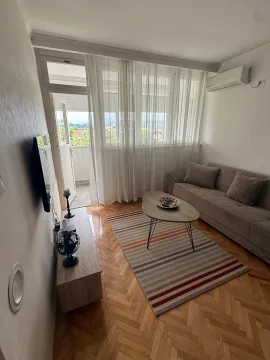 Living room with sofa, coffee table and access to the terrace. - image 12