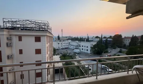 View of the city and landscape from the balcony at dusk. - image 12