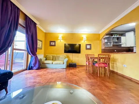 Living room with sofa, dining area, and access to the terrace. - image 3