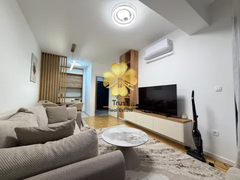Modern and bright living room with a sofa and television. - image 4