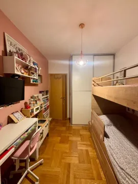 Children's bedroom with a bunk bed, desk, and wardrobe. - image 11