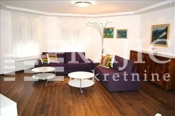 Spacious and bright living room with a seating set and wooden flooring. - image 3