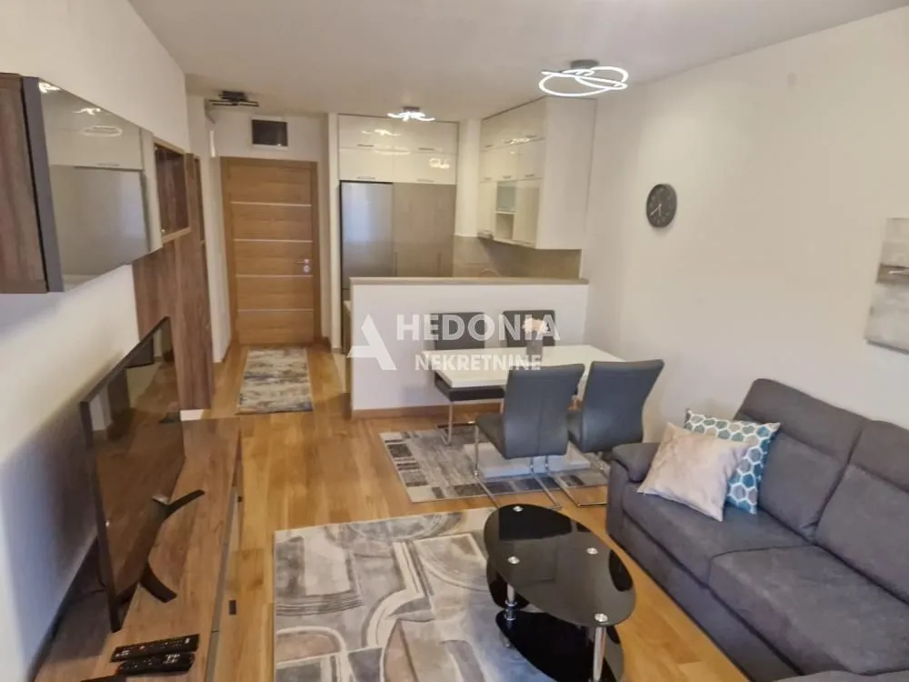 Living room with dining area and kitchen in the extension.