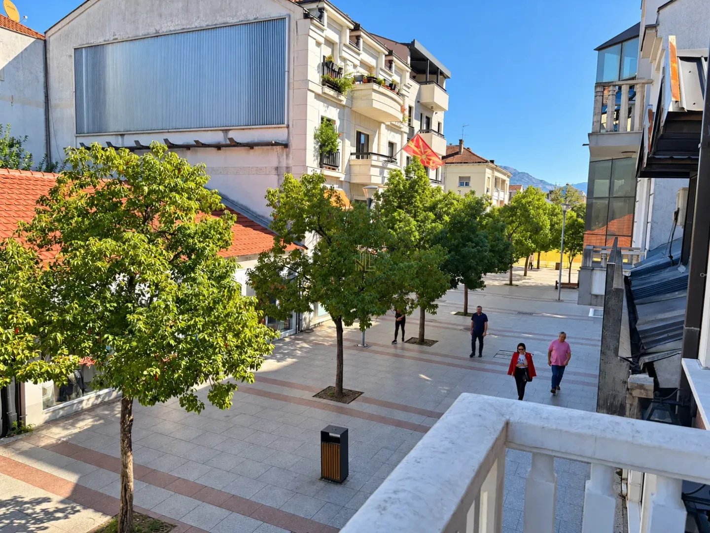 View from the balcony overlooking the pedestrian zone and surrounding buildings.